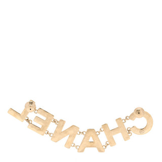 Chanel Metal Enamel Cha-Nel Logo Brooch