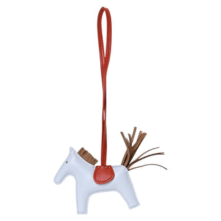 Hermès Grigri Rodeo PM Horse Bag Charm In Milo Lambskin Bleu Brume, Chai & Cuivre
